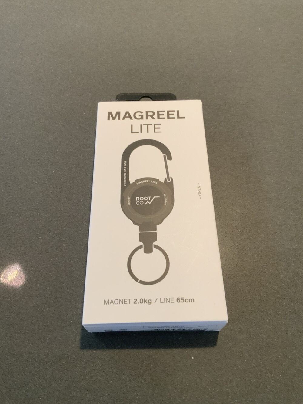 NEW ROOT CO. GRAVITY MAG REEL LITE a carabiner reel with a built-in magnet